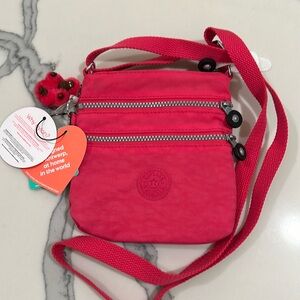 Kipling vibrant pink sling bag NWT